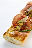 Baguette with ham, Parmesan and grilled vegetables