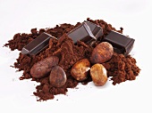 Pieces of chocolate, cocoa powder and cocoa beans