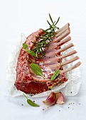 A rack of lamb with fresh herbs
