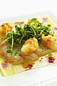 Rohe und frittierte Langustenstücke auf Limetten-Chili-Marinade mit Kressesalat