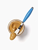 Jar of Peanut Butter; Knife with Peanut Butter on It; From Above; White Background