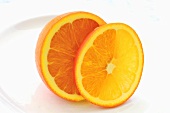 Half an orange and and orange slice