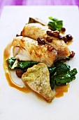 Fillet of bream with chard, artichokes and raisins