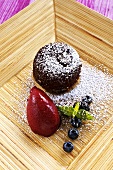 Warm chocolate cake with berry sorbet