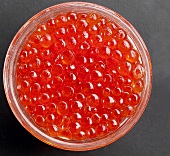 Salmon caviar in a glass bowl