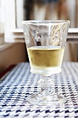 Cold Glass of White Wine on a Table in Paris, France