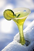 Lime Martini in Fun Stem Glass with Lime Garnish; On Snowy Railing