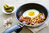 A farmer's breakfast with fried potatoes and a fried egg