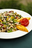 Bowl of White Bean Salad with Papaya Garnish