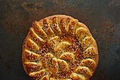 Round Loaf of Decorative Bread with Sesame Seeds