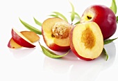 Nectarines, whole, halved and slices