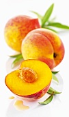 Yellow flesh peaches, whole and halved