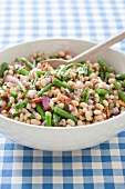 White Bean Salad with Green Beans and Onions; In Serving Bowl with Wooden Spoon