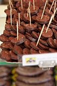 Boudin Noir (French black pudding) sliced on a market stand
