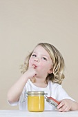 A girl eating lemon curd