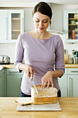 A woman cutting bread