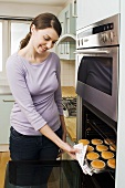 A woman baking cakes