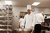 Chefs preparing food in a commercial kitchen