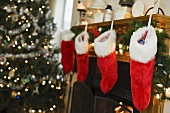Christmas stockings hanging by a fireplace