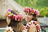 Young women with flowers in hair in moorea