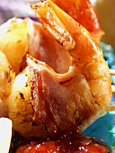 Grilled scampi wrapped in bacon