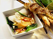 Pork and shrimp kebabs with Asian vegetable salad