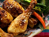 Asian chicken legs with sesame and chili peppers