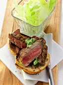 White bread sandwich with barbecued pork neck: lettuce