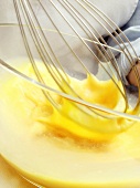 Beating eggs with whisk