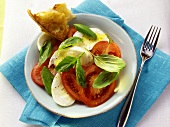 Tomatoes with mozzarella and basil; white bread