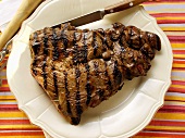 Barbecued lamb steak on plate