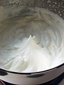 Whipped cream in mixing bowl
