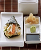 Temaki sushi with crabmeat and avocado; ginger; wasabi