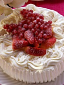 Cream cake with berries, nectarines and icing sugar