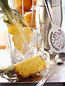 Various bar utensils, glasses, ice cubes and fruit