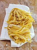 Home-made tagliatelle on white cloth