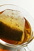 Tea in glass cup with tea bag