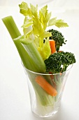 Celery, carrots and broccoli in glass