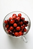 Fresh cranberries in glass (from above)