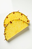 Slice of pineapple, halved