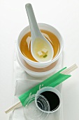 Miso soup to go; chopsticks; soy sauce