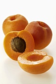 Fresh apricots, one halved