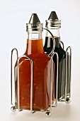 Chili sauce and soy sauce in small bottles