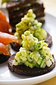 Pumpernickel rounds with avocado