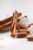 Cinnamon sticks, almonds and icing sugar