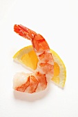 Cooked, peeled shrimp on wedge of lemon