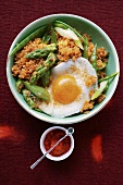 Quinoa with ajvar, green asparagus and fried egg