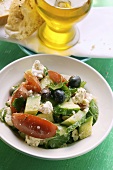 Greek salad with white bread and olive oil