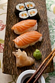 Nigiri-sushi and maki-sushi with ginger, soy sauce, wasabi