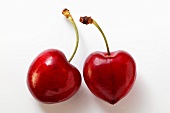 Two red heart cherries